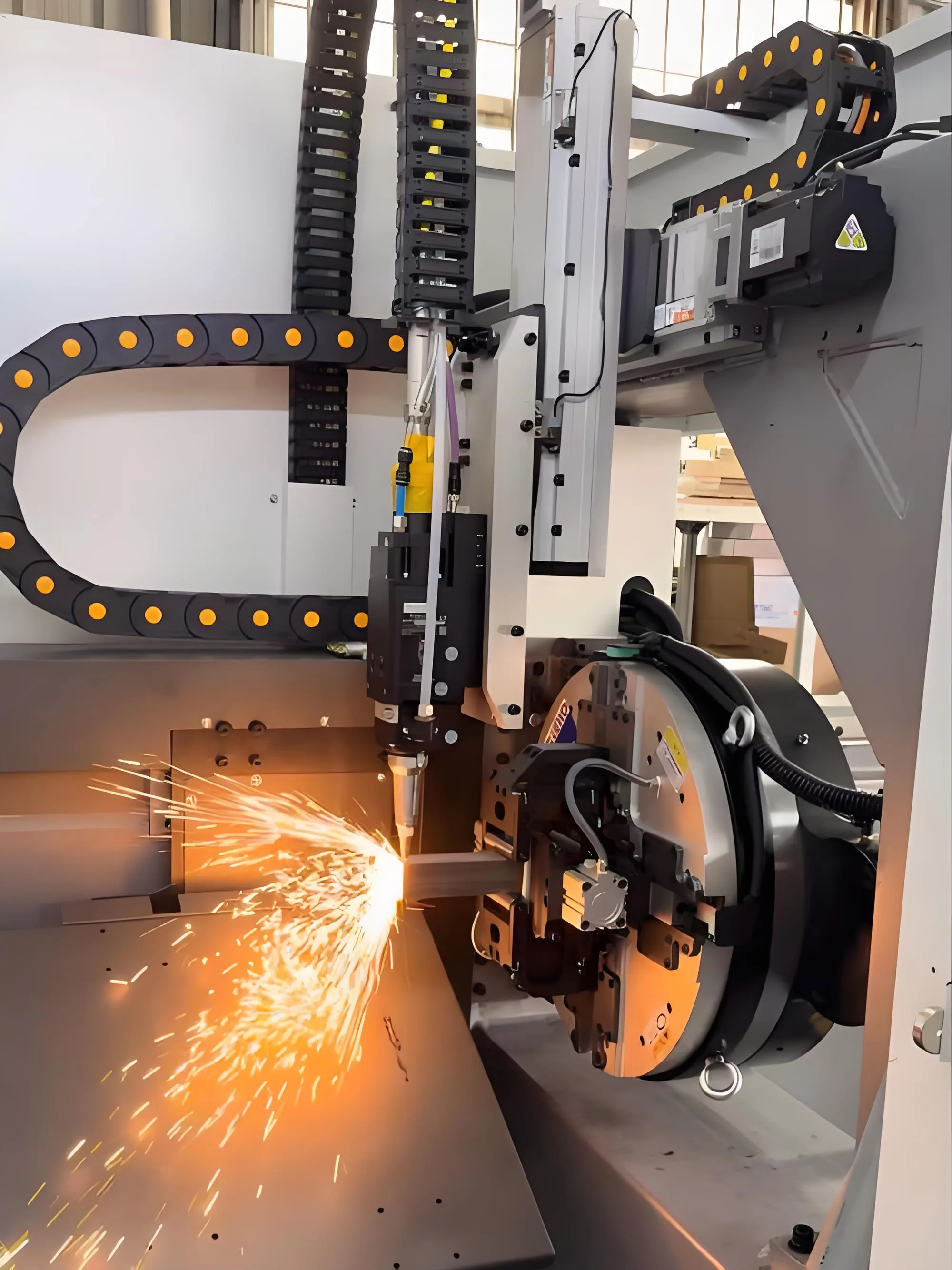 TY-S120-G laser tube cutting head and pneumatic chuck cutting a square tube